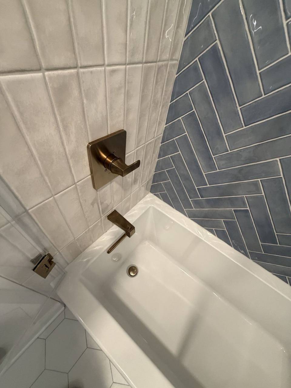 Herringbone tile tub surround