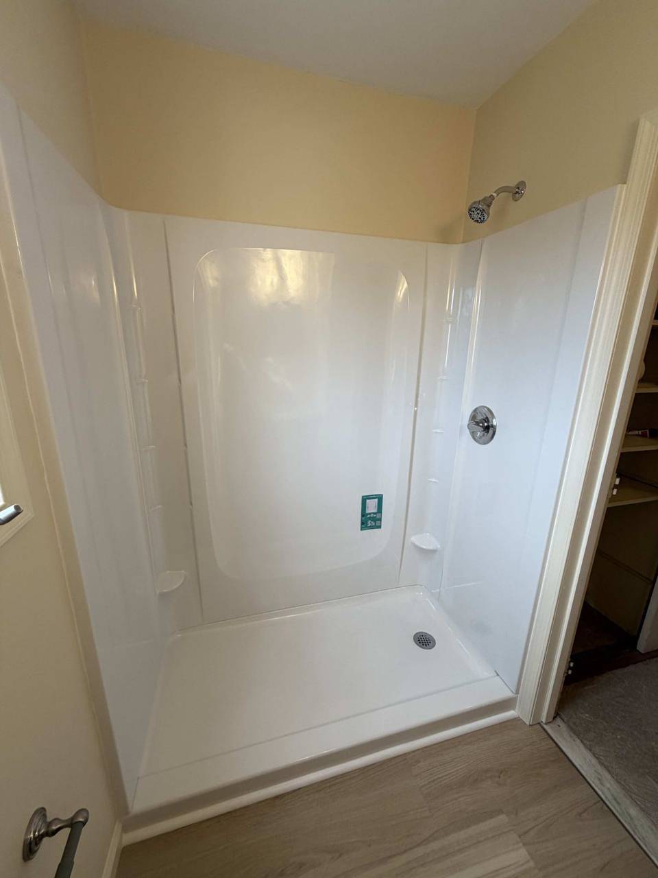 Bathroom after remodel — new shower unit