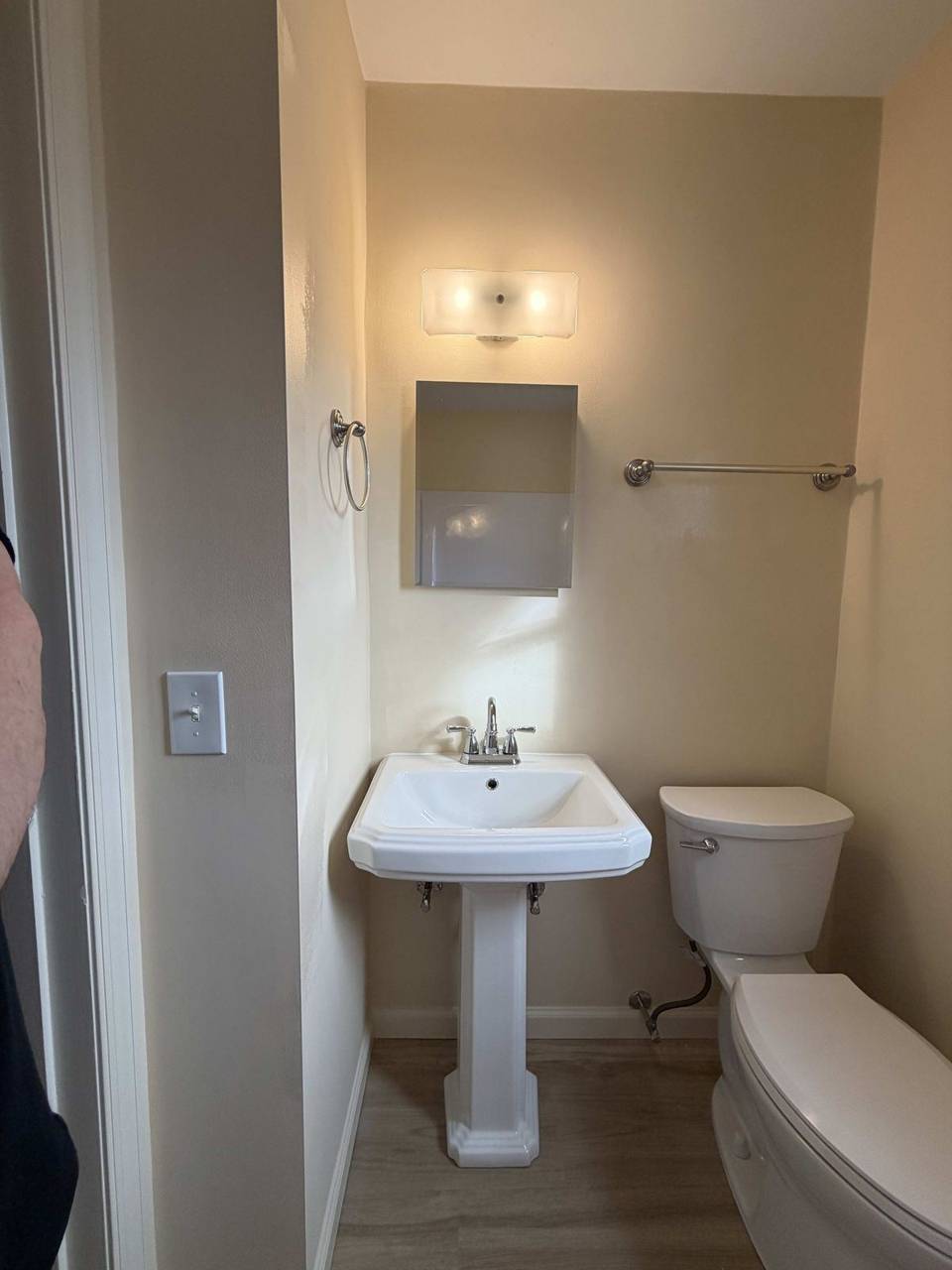 Finished powder room with pedestal sink
