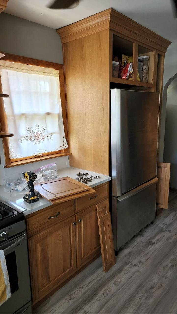 Oak kitchen cabinets before refinishing, doors removed