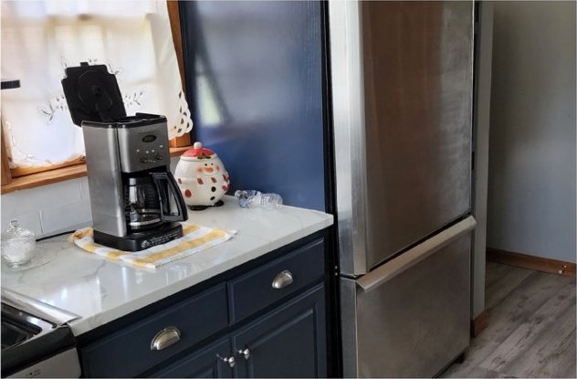 Fridge wall cabinets refinished in deep navy