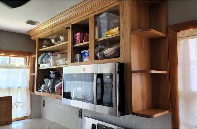 Oak cabinets over the microwave before refinishing