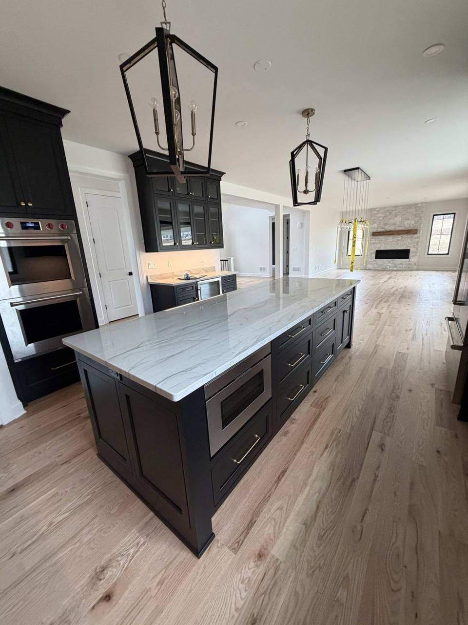 Black cabinet kitchen with island