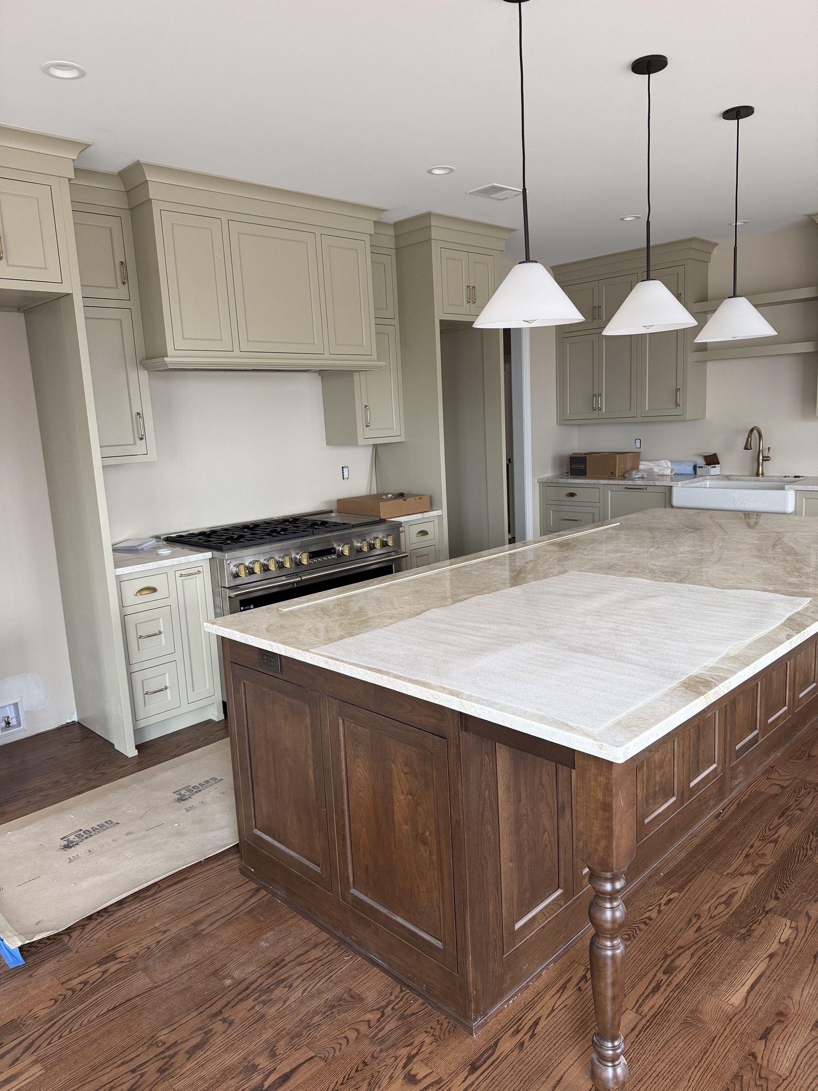 Kitchen with cream cabinets and wood island