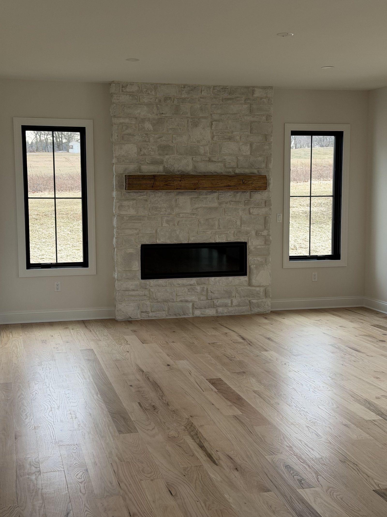 Living room with stone fireplace